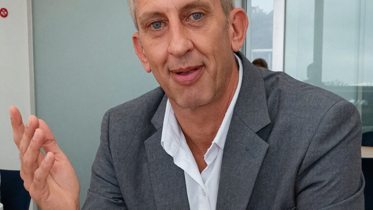 Nick Hall mid-conversation in a meeting
